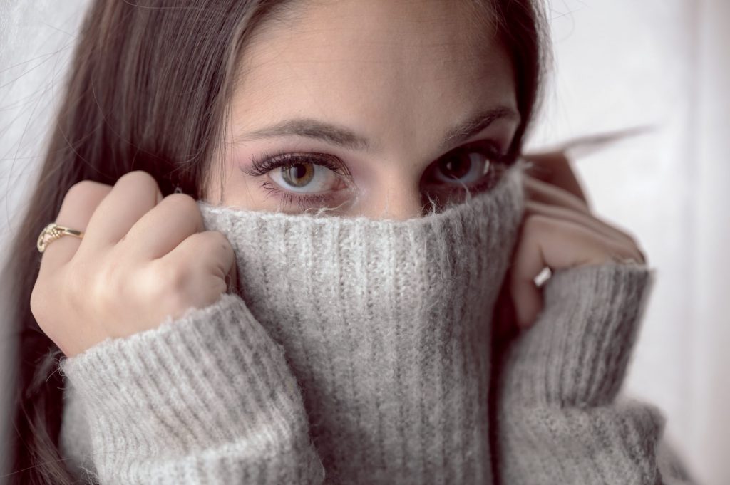 woman hiding her face