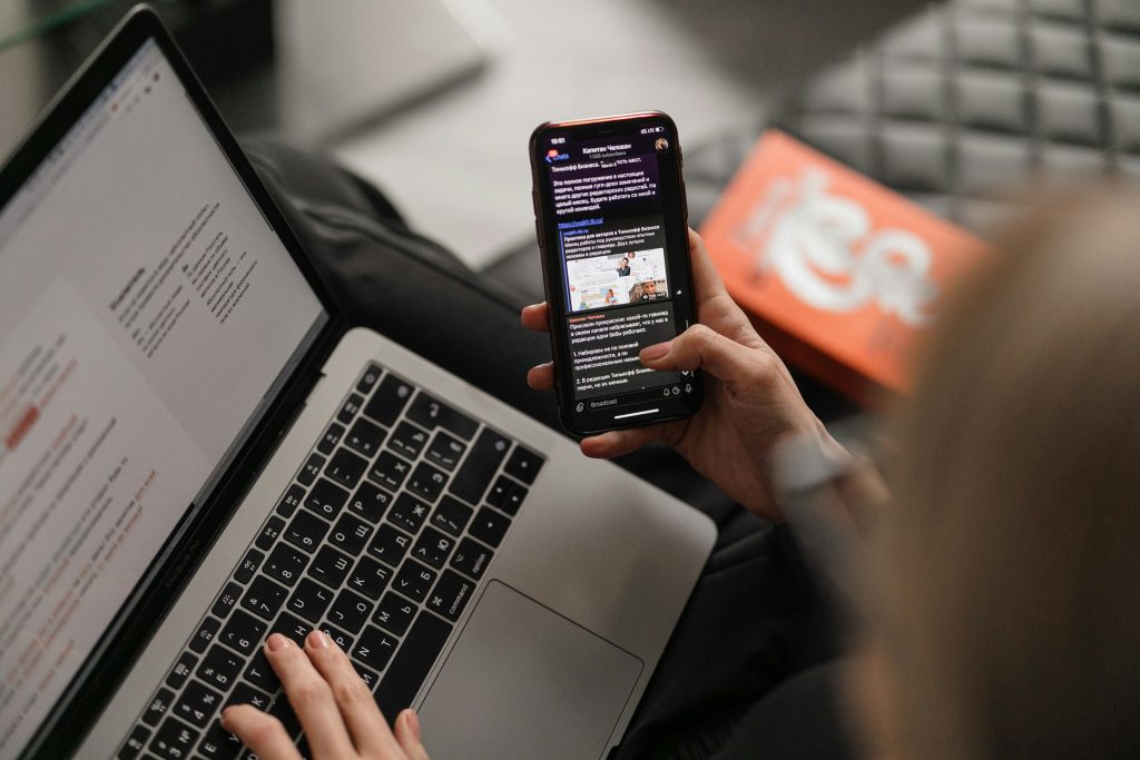 Person using phone to find social media accounts linked to email address