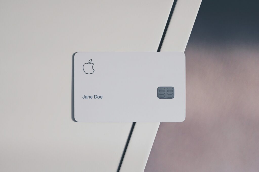 Apple Card on white surface — Apple gift card scams and romance scam warning signs