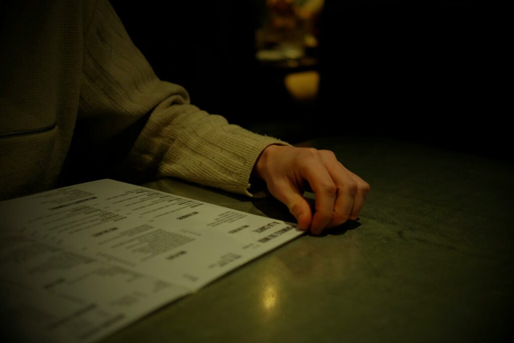 Person reviewing official records and documents during a criminal background check or public records search.
