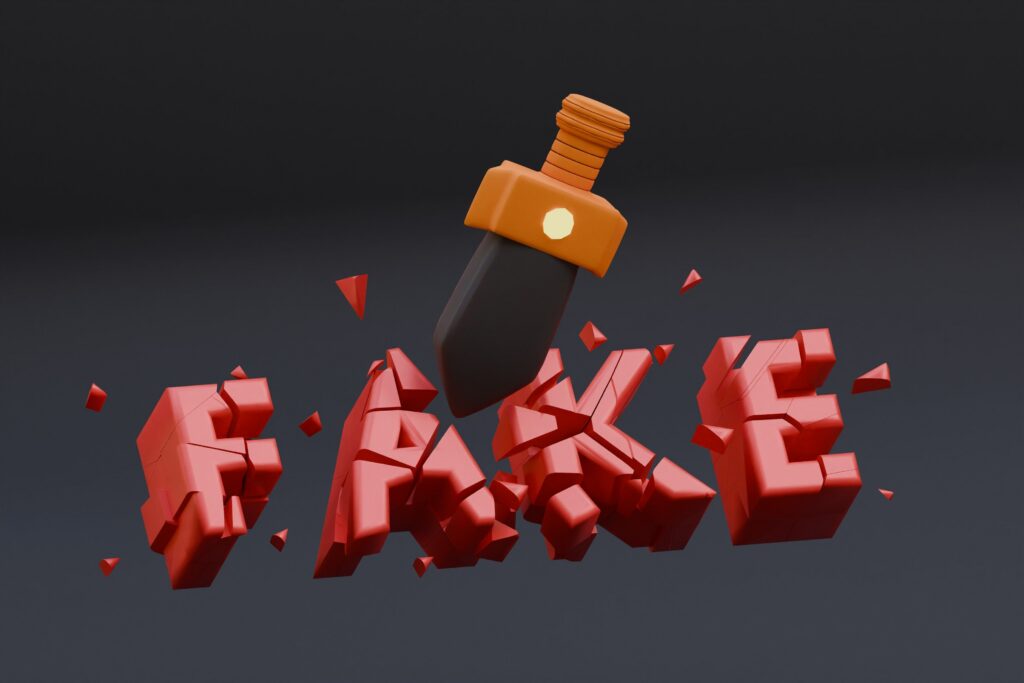 A 3D illustration of a sword smashing the word FAKE, representing how to verify Roblox accounts and identify fake or suspicious players online.