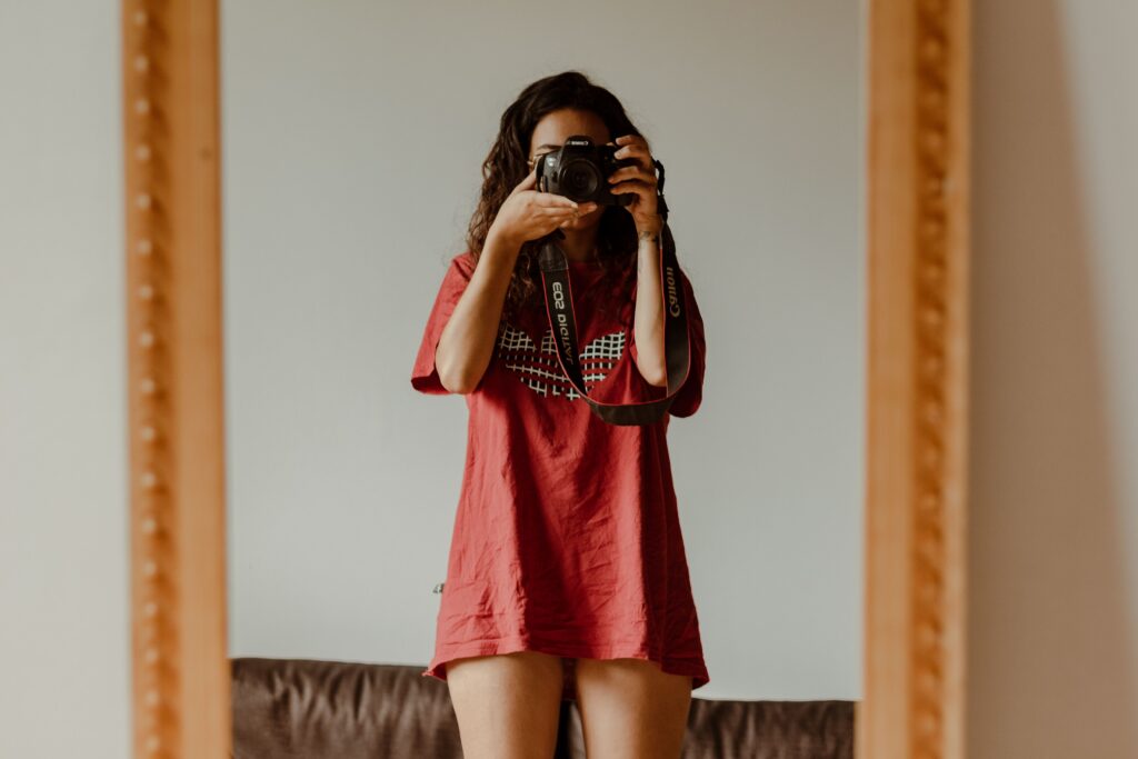 women taking picture of herself for onlyfans